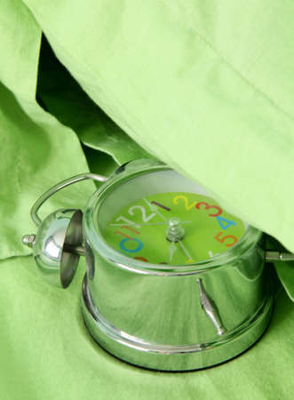 green alarm clock under your pillow