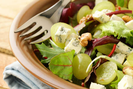 Mix salad with grapes and walnuts with blue cheeseの写真素材