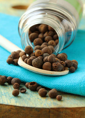Heap of  black pepper on the board 