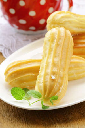 cake eclair profiteroles on a plate 