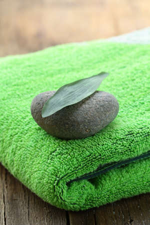 green towel, stone and leaf - Zen Conceptの写真素材
