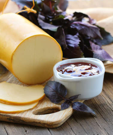 Smoked cheese with jam and fresh herbs