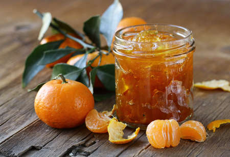 orange mandarin homemade jam marmelade in a glass jarの写真素材