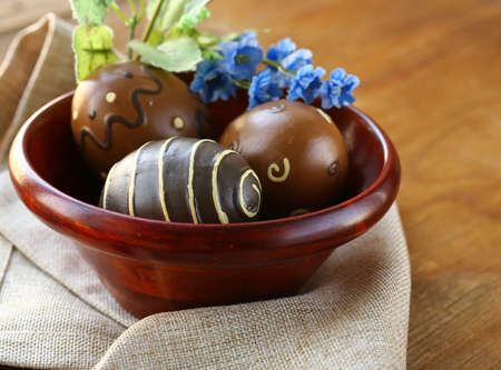 Easter decor eggs on wooden background