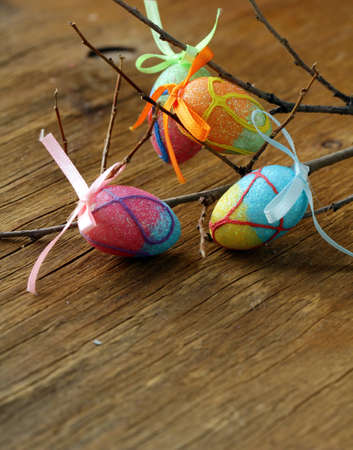 Easter decor eggs on wooden background
