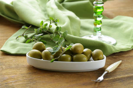 green marinated olives  with oreganoの写真素材