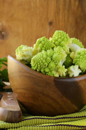 romanesco cabbage cut in a wooden bowlの写真素材