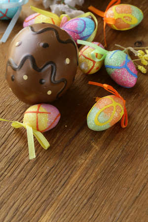 Easter decor eggs on wooden background