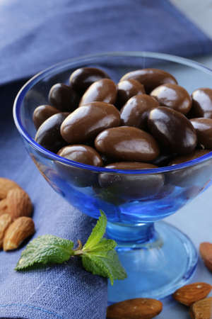 almonds in chocolate in a blue vaseの写真素材