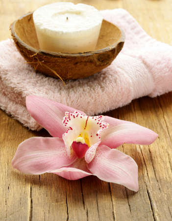 spa concept - pink orchid on a wooden backgroundの写真素材