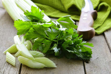 fresh chopped celery on a wooden tableの写真素材
