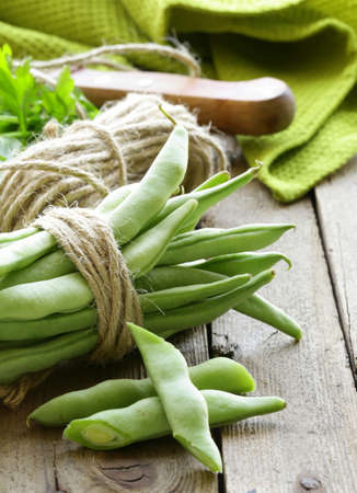green peas on a wooden table, rustic style