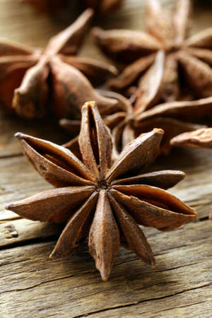 macro shot spice star anise on a wooden backgroundの写真素材