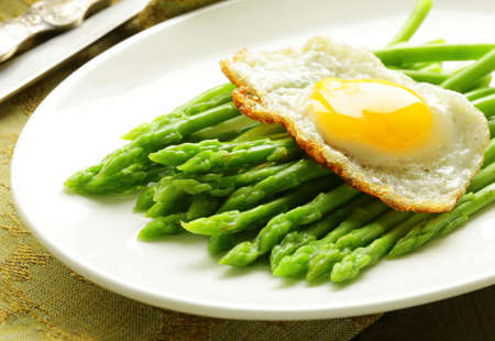 gourmet breakfast - asparagus with fried eggの写真素材