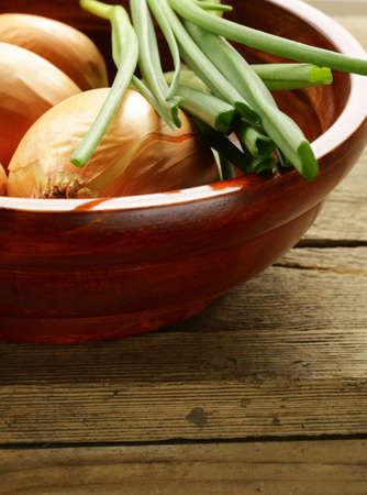 fresh onions green and shallot on a wooden backgroundの写真素材