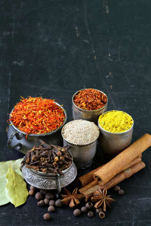 collection of various spices  paprika, turmeric, pepper, aniseed, cinnamon, saffron 