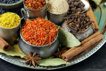 collection of various spices  paprika, turmeric, pepper, aniseed, cinnamon, saffron の写真素材