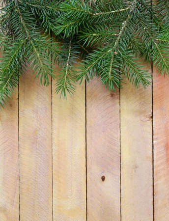 Christmas wooden background is green fir tree  branchesの写真素材