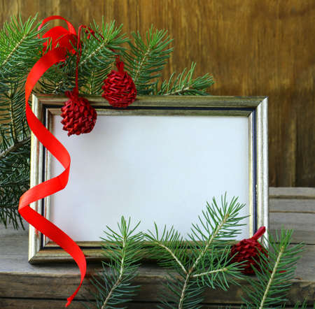 Christmas wooden gold frame and fir tree  branches