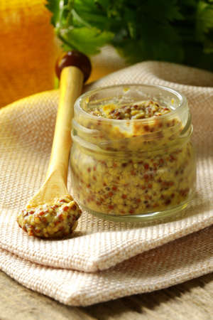 Traditional dijon mustard in a glass jarの写真素材