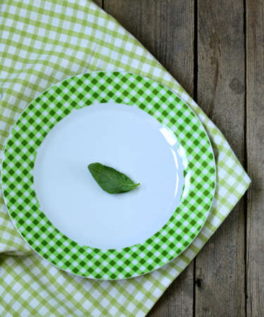 empty plate with green cell  on the wooden backgroundの写真素材