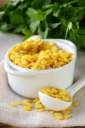 yellow lentils in a bowl on the table