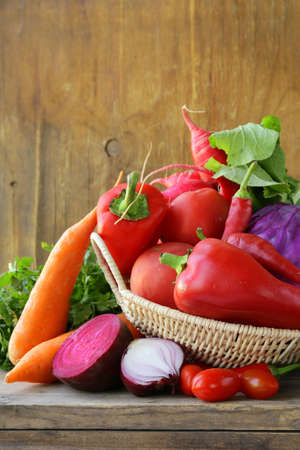 assorted different red vegetable  tomato, pepper, chili, carrots, beets, cabbage, radishes の写真素材
