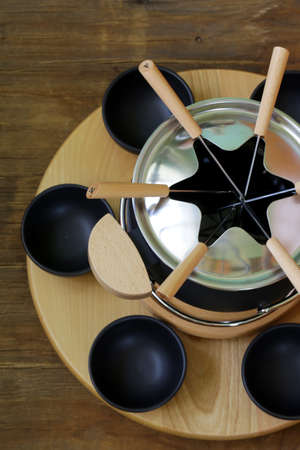 special set of utensils for cooking fondue  cheese, chocolate の写真素材