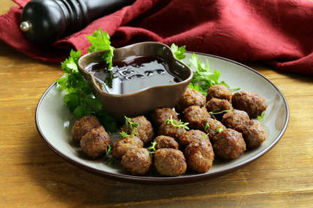 meatballs - traditional meat dish with sauce and herbsの写真素材