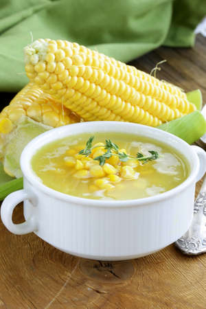 soup of fresh yellow corn served on a wooden tableの写真素材