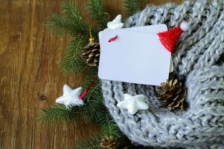 Christmas composition with a knitted scarf and decorationsの写真素材