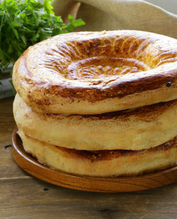 traditional Middle Asian bread, tortillas pile on a wooden tableの写真素材