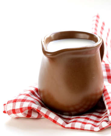 ceramic brown  jug full of milk, rustic styleの写真素材