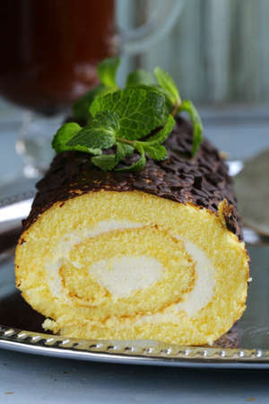 vanilla roll cake with chocolate ganache and  creamy creamの写真素材