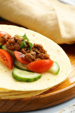 Fresh tortilla fajita wraps with beef and vegetables, Mexican foodの写真素材