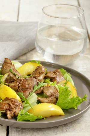 gourmet salad with a roasted chicken liver and appleの写真素材