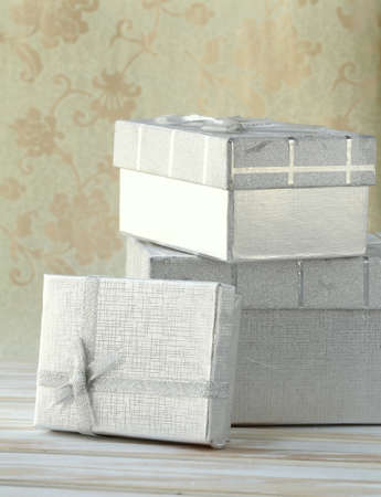 many silver gift boxes on vintage backgroundの写真素材