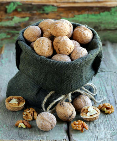 linen bag with whole ripe walnutsの写真素材
