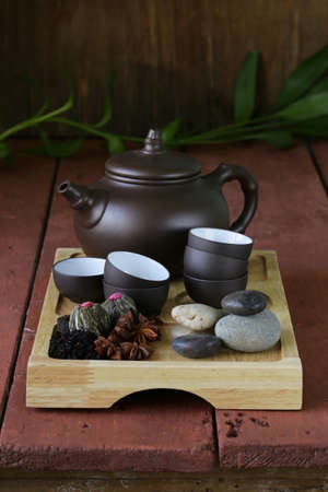 set for a traditional tea drinking  kettle, cups and various grain tea 
