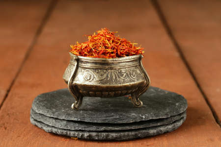 Saffron spice in metal bowl