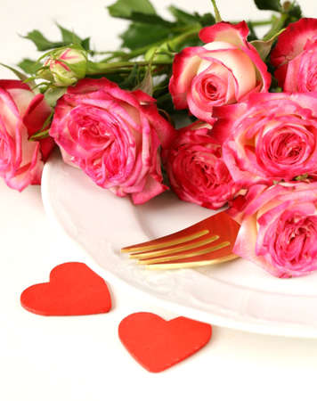 romantic table setting with roses for the holiday St  Valentineの写真素材