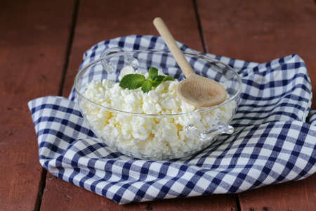 Fresh natural organic cottage cheese in a glass bowlの写真素材