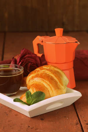 elegant coffee break or breakfast cup of coffee and croissantの写真素材