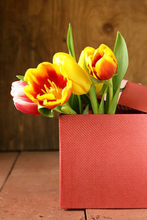 spring tulips flowers on a wooden backgroundの写真素材