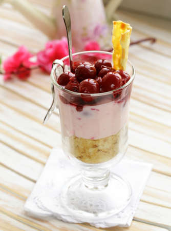 dairy dessert trifle with cherry in a glassの写真素材