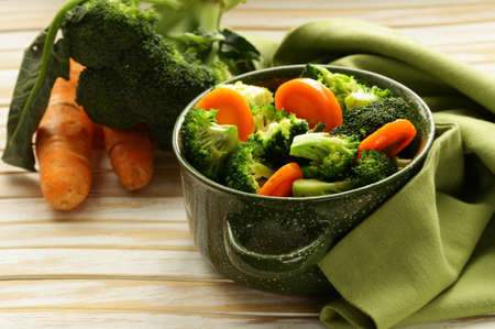 mixed vegetables with carrots and broccoli tasty garnishの写真素材