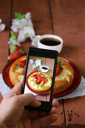 smartphone shot food photo -  vanilla cake with strawberriesの写真素材