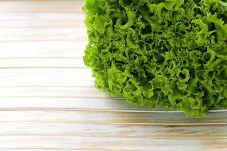 great fresh organic green lettuce on a wooden background