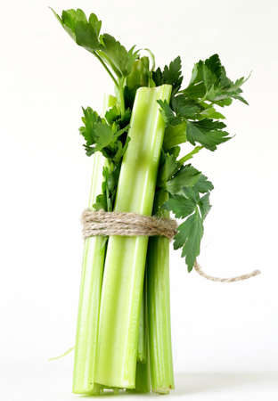 bunch of green celery on a white backgroundの写真素材