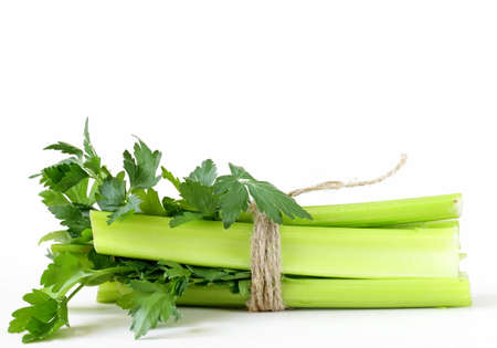 bunch of green celery on a white backgroundの写真素材